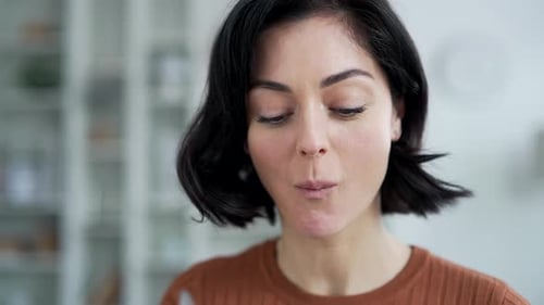 Attractive Woman Eats Salad in Close Up