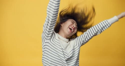 Happy Woman Letting Down Her Hair and Smiling