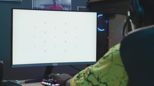 Teen Gamer Playing on Computer with Blank Screen