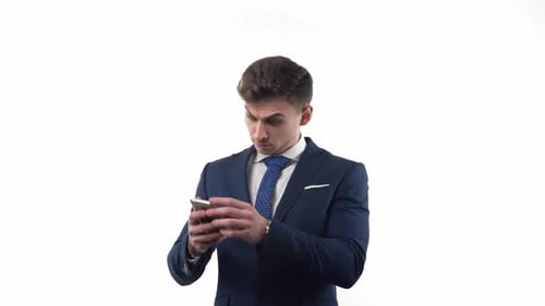 Excited Man Celebrates Mobile Win in Studio