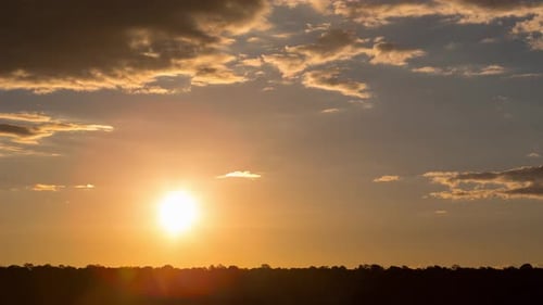 Brilliant Sunrise Time Lapse with Dark Clouds