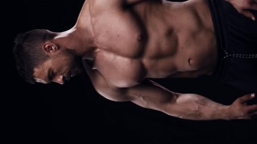 Fit and Sporty Bodybuilder Over Black Background Bodybuilder Training Using Barbell The Concept of