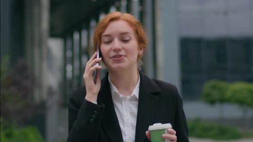 Cheerful Woman Talking on Phone, Walking in City