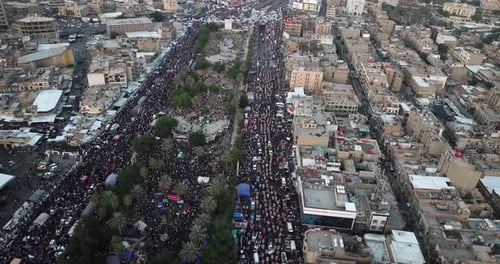 Large Crowd Moving Through a Densely Populated City