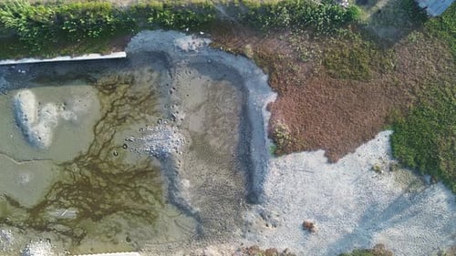 aerial view of the water in a dry dam due to drought