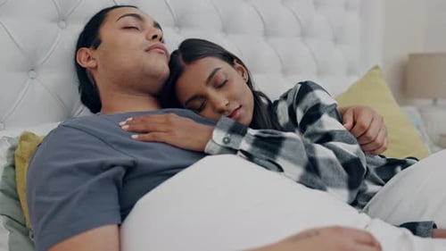 Loving Couple Sleeping Peacefully in Bed Together