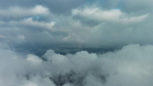 Aerial High View of Dramatic Clouds Flying