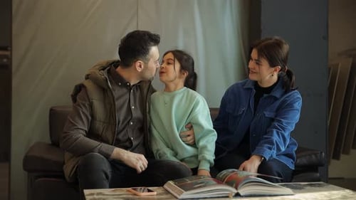 Family Reads Together on Couch in Living Room