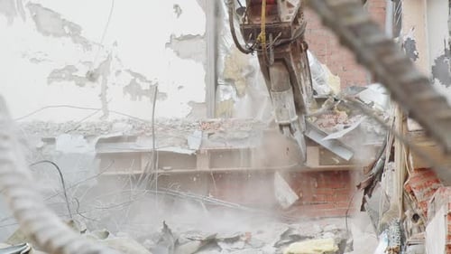 Machine Crashes Concrete Beam of Ruined Hockey Stadium