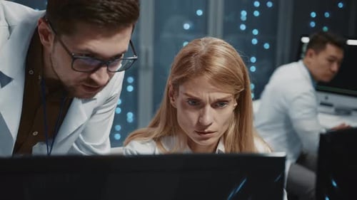 Scientists Analyzing Data in Futuristic Lab