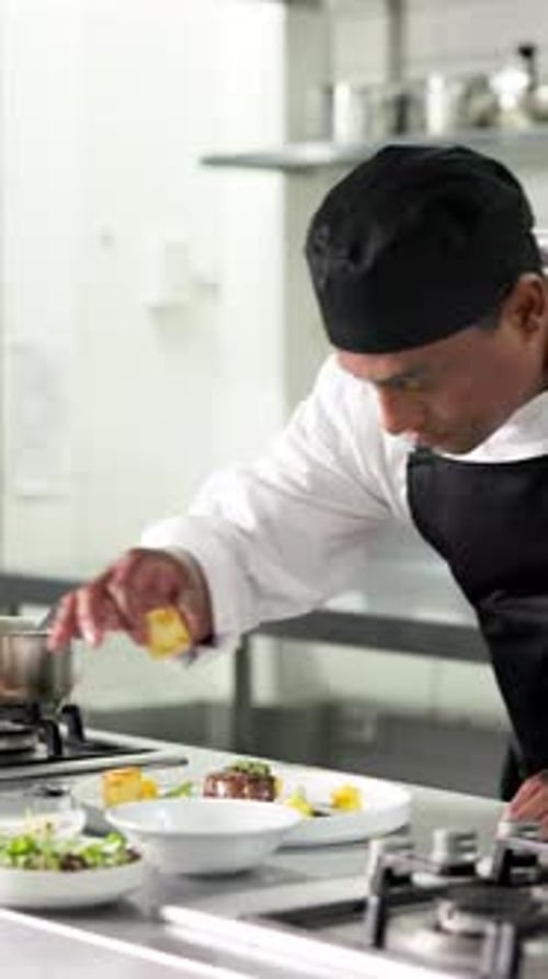 Chef Prepares Gourmet Dish in Restaurant Kitchen