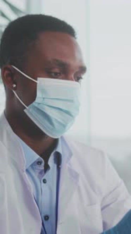 Healthcare Professional at Bright Clinic Carefully Assembly of Covid Vaccination Syringe While