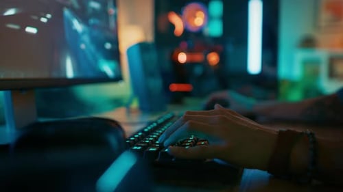 Close Up Hands Shot Showing a Gamer Pushing the Keyboard Buttons while Playing an Online Shooter Vi