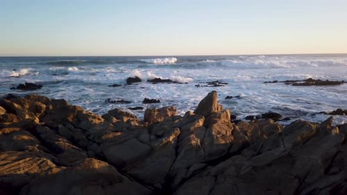 Ocean sunset on a rock beach in South Africa