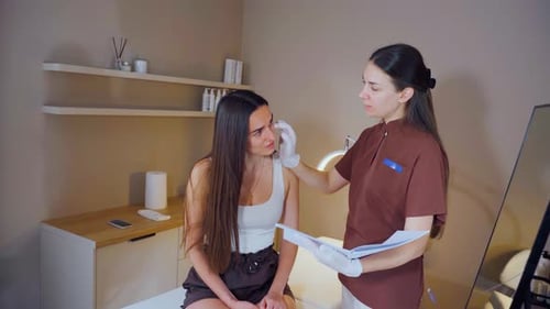 Woman Consults with Doctor at Medical Clinic