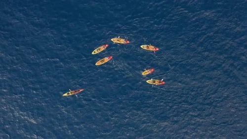 Colorful Kayaks In Blue Ocean Water