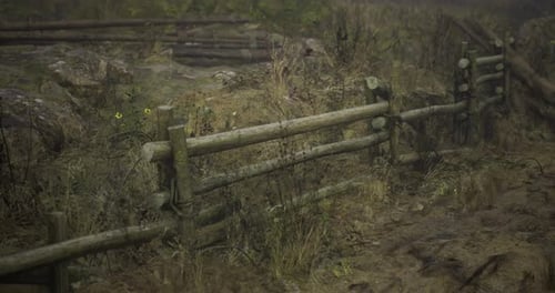 Slow Camera Movement Past Rustic Wooden Fence in Nature