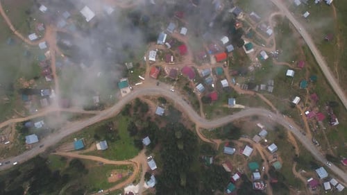 Village And Rural Road From Clouds Above