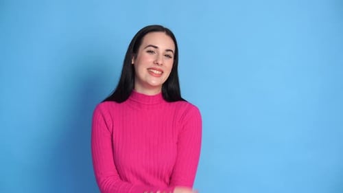 Beautiful Young Woman Smiling in Studio Setting