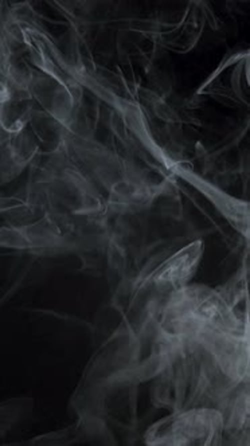 White Smoke Drifting on Black Background
