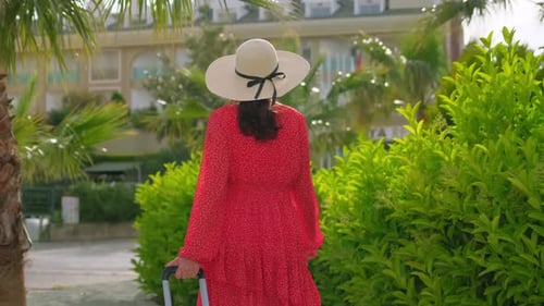 Traveler Woman Walking with Suitcase at Hotel Tourist Resort Travel Tourism Vacation