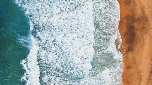 Ocean Waves Roll On The Sandy Beach