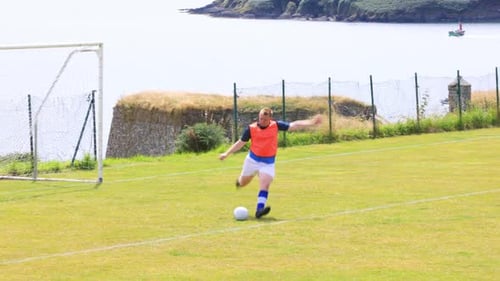 Gaelic Football Practice on a Grassy Field
