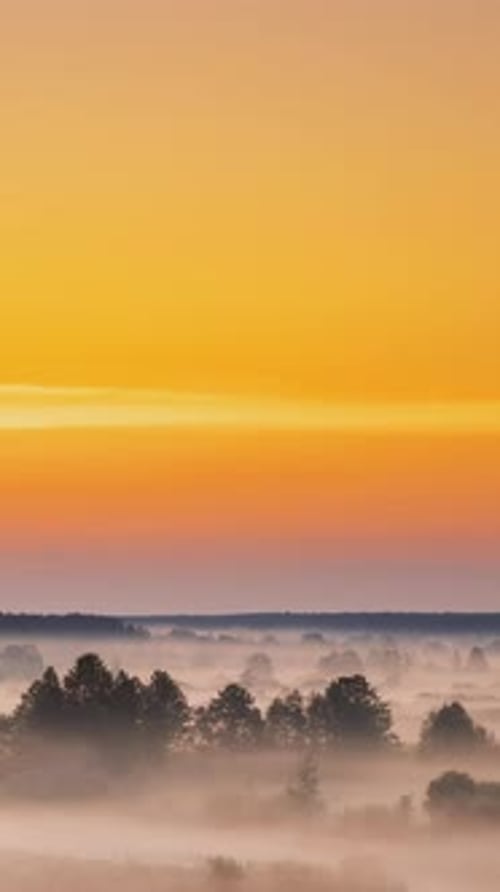 Amazing Sunrise Over Misty Landscape Scenic View Of Foggy Morning Sky With Rising Sun Above Misty