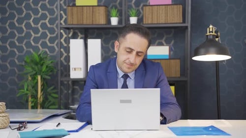 Executive Works at Computer in Modern Office
