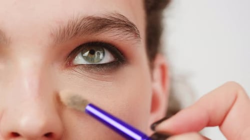 Beauty Shot of Woman Makeup Artist Applying Foundation Bb Cream on Previously Applied Moisturizing