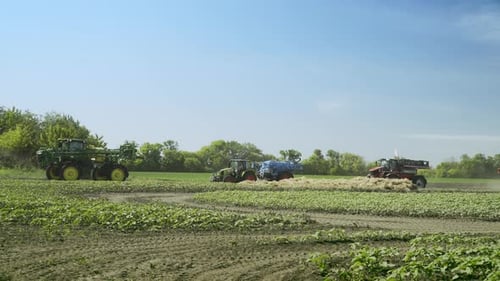 Agricultural Machinery Working on Farming Field. Agricultural Equipment for Harvesting Field. Combin