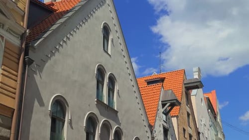 Explore the Charming Architectural Details of Beautiful Historic Buildings Set in a Lively Street