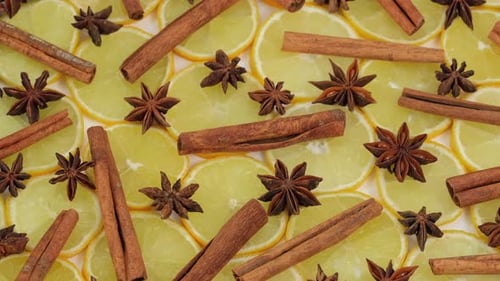 Lemon slices, star anise, cinnamon close-up, food summer background