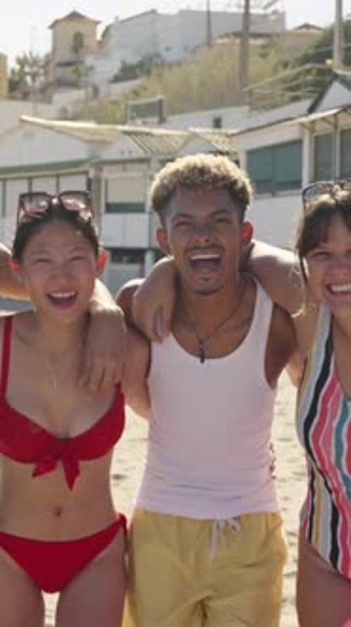 Happy Group of Diverse Friends in Swimwear are Standing Next to Each Other on the Beach