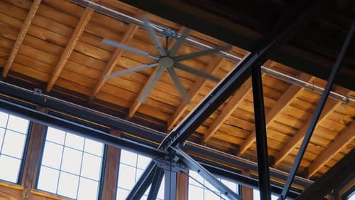 Spinning Industrial Fan in Modern Workplace
