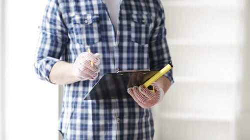Repair, Building, Construction and People Concept - Close Up of Man With