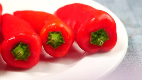 Close Up of Short Red Peppers on Plate