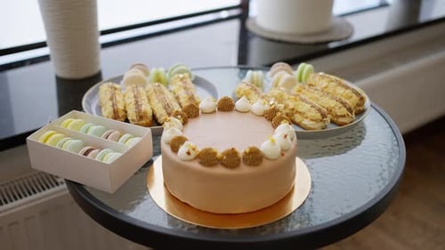 Decadent Cake with Macarons and Eclairs Dessert Display