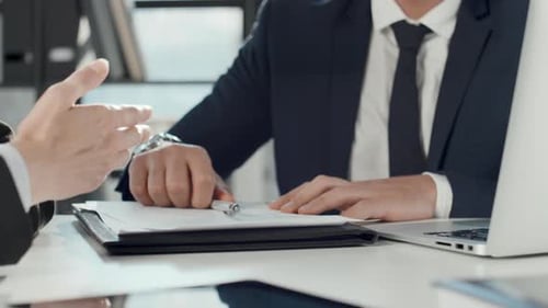 Businessmen Signing Contract and Shaking Hands in Office