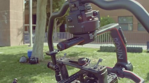 DSLR Camera Installed In A Gimbal Under The Sunlight - Ronin Gimbal Stabilization Device - close up,