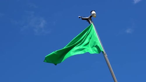 Bright Green Flag Blowing in the Wind