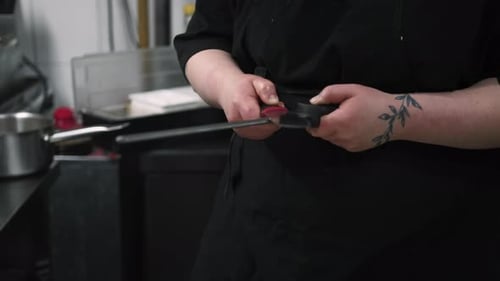 Chef Sharpening Knife with Honing Steel in Kitchen
