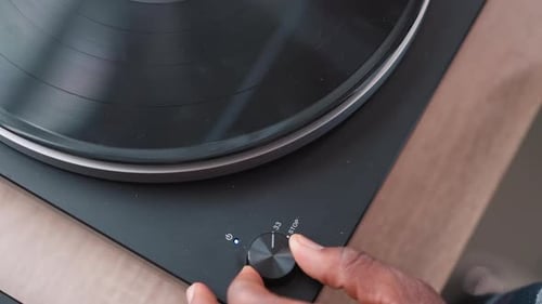 Hand of Man Activates Switch on Turntable