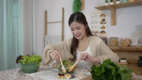 Young Woman Enjoys Healthy Salad at Home