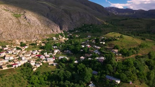 Aerial view mountain range with a small village in the valley