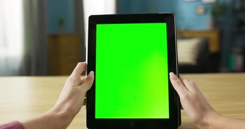 Woman Holds Tablet with Chroma Key Screen