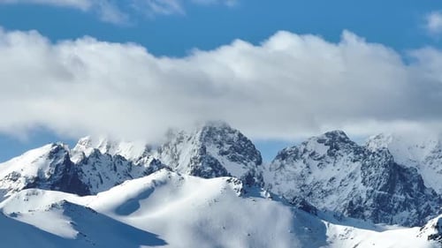 Snowy Mountains Under Blue Sky in Winter