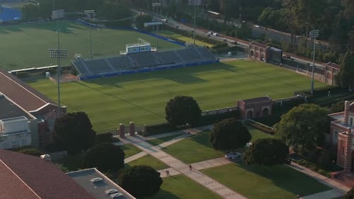 Early Morning Aerial View of UCLA Campus with Historic Royce Hall and Lush Greenery in Los Angeles