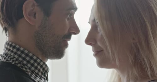 Affectionate Couple Touching Foreheads and Smiling