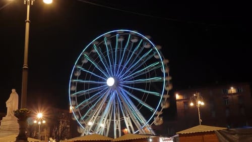 big colourful ferris wheel in the centre of the city of ancona in Italy